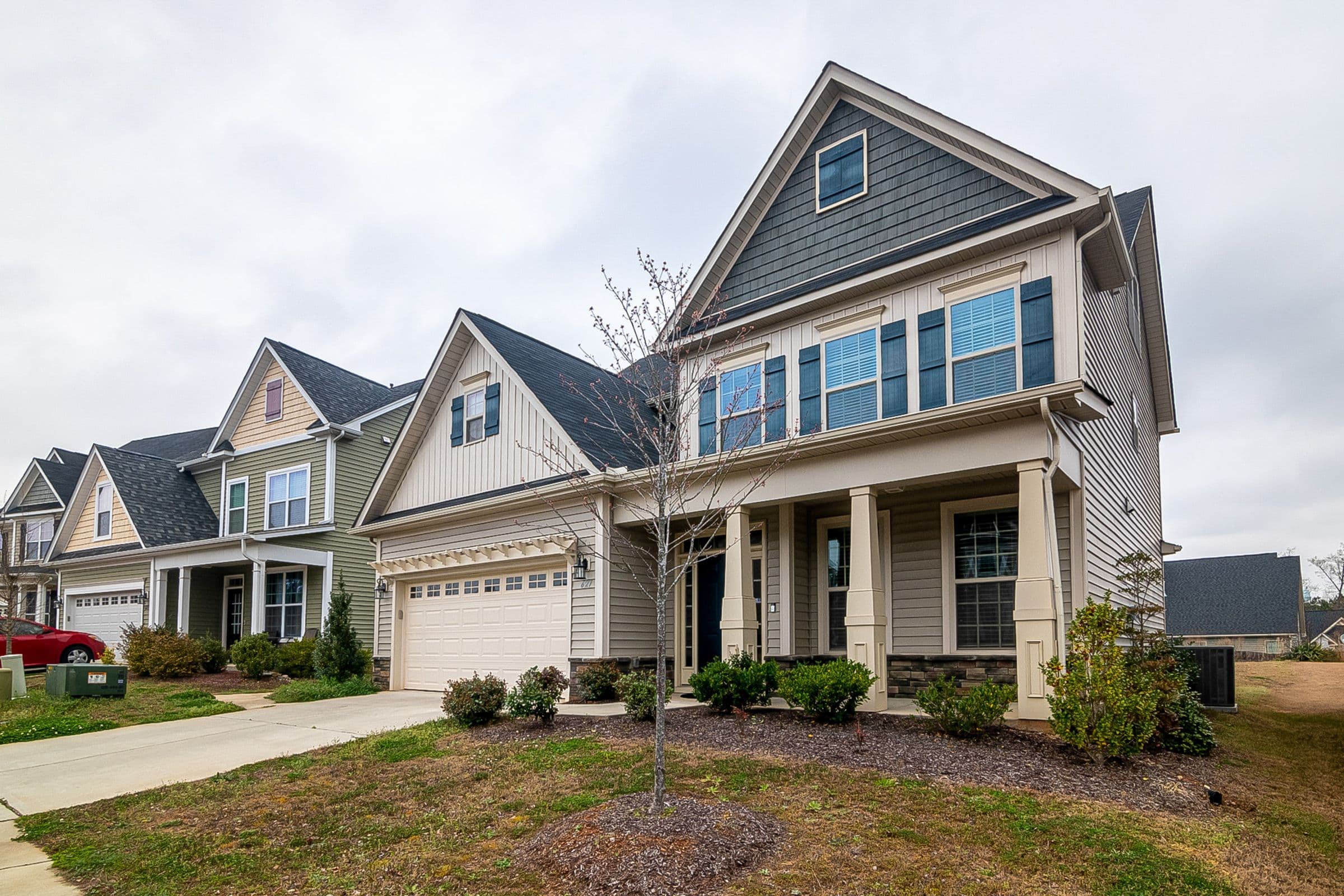 Suburban two-story homes with gabled roofs and front lawns in Post Falls, Idaho