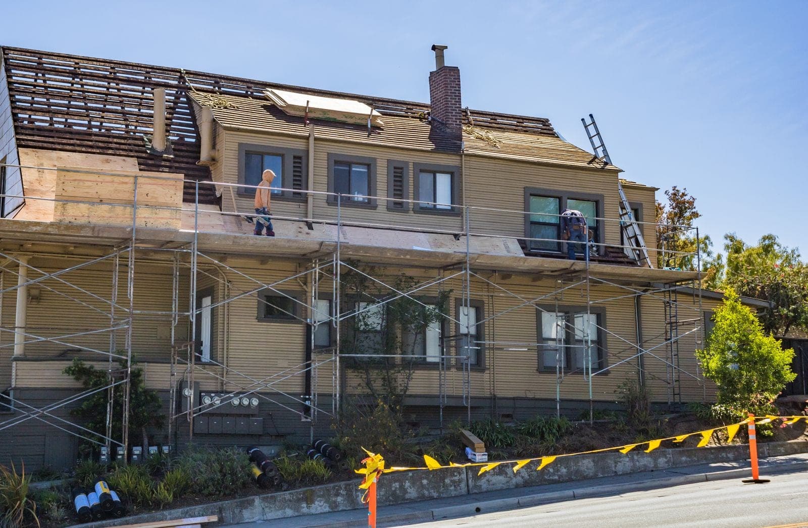 House with scaffolding during a roof replacement