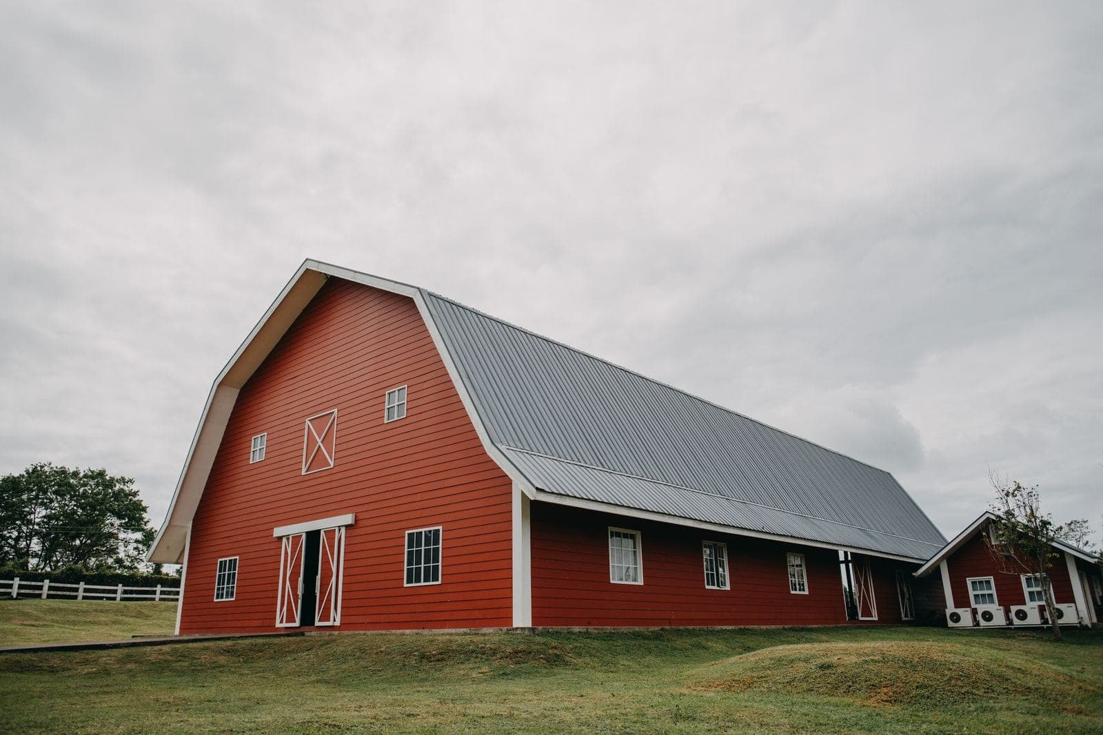 Large red barn with a gray metal roof